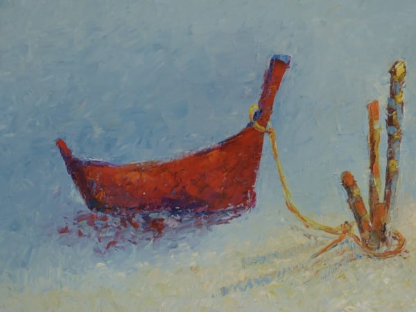 Fishing boat tied up on the beach by Ta Thimkaeo