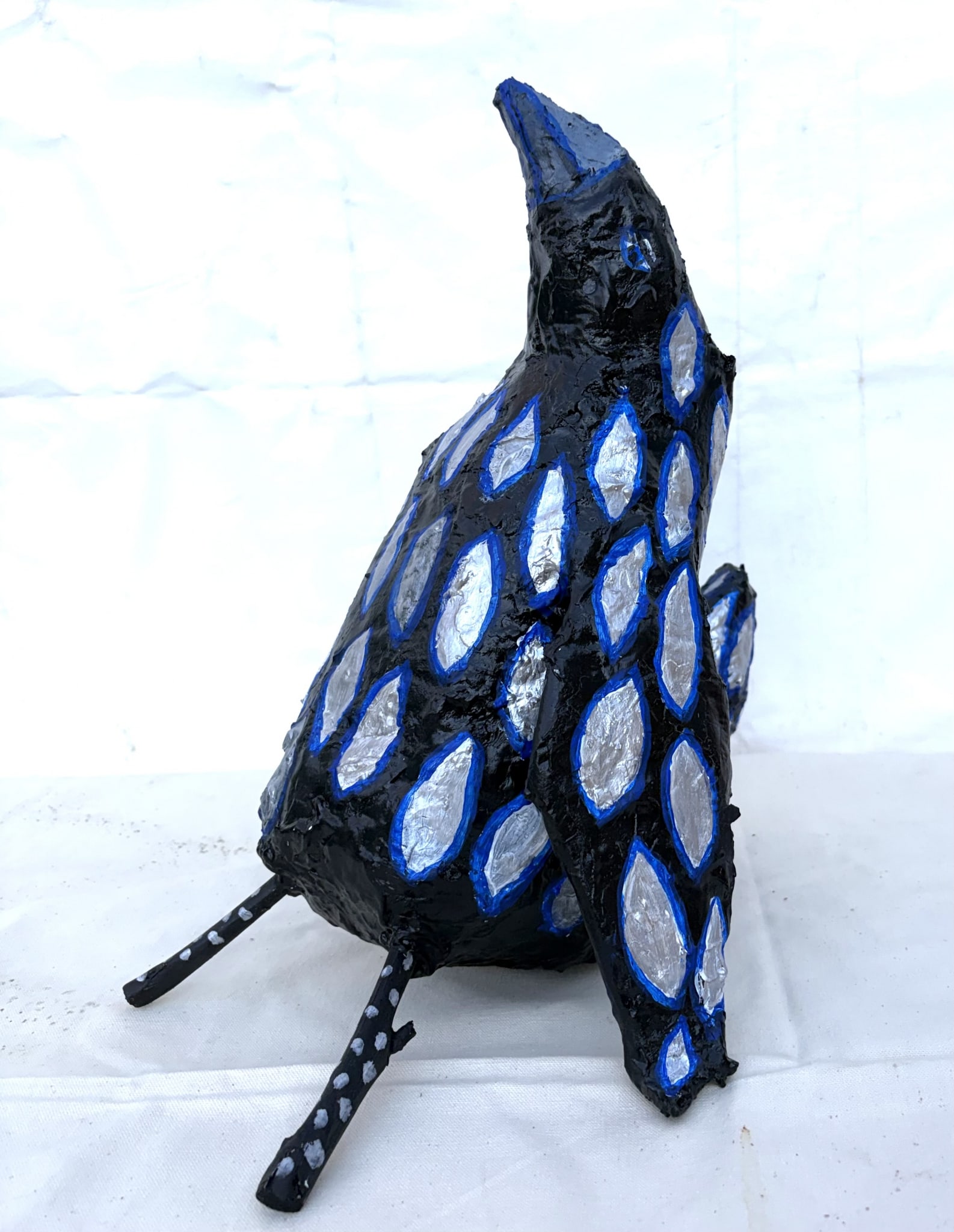 Silver feathered raven by Anna Jewel Gove